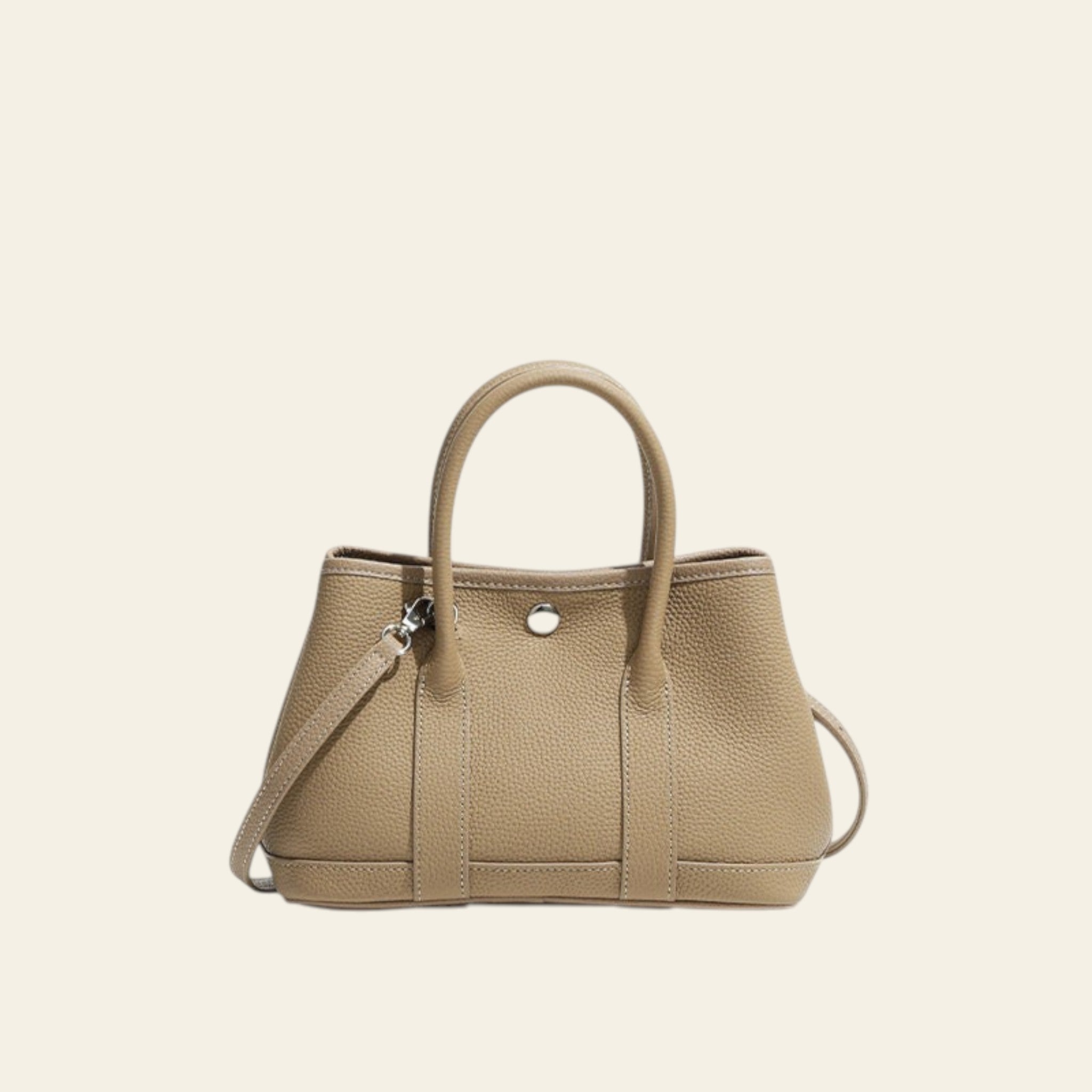 Beige handbag with a strap on a white background