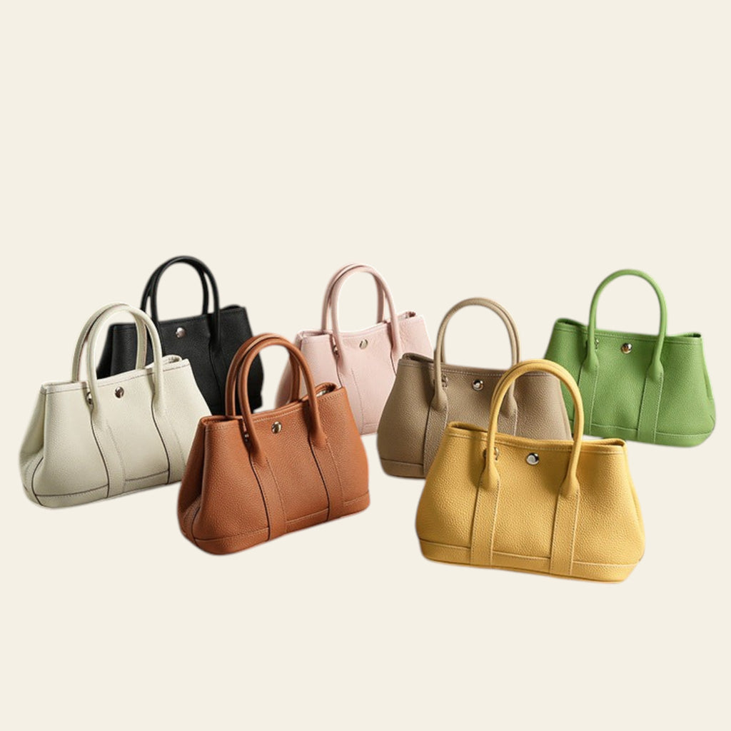 Row of colorful handbags on a neutral background