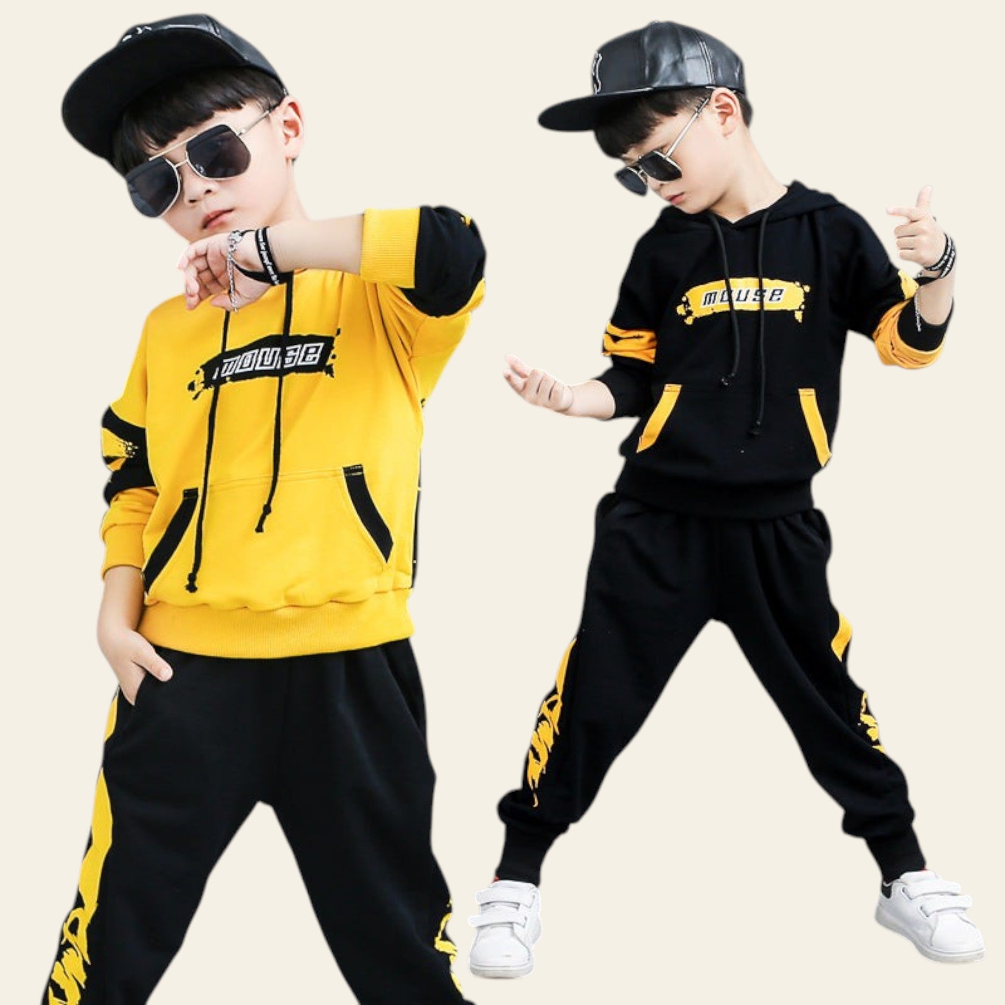 Two children in matching yellow and black outfits with sunglasses and hats posing against a gray background.