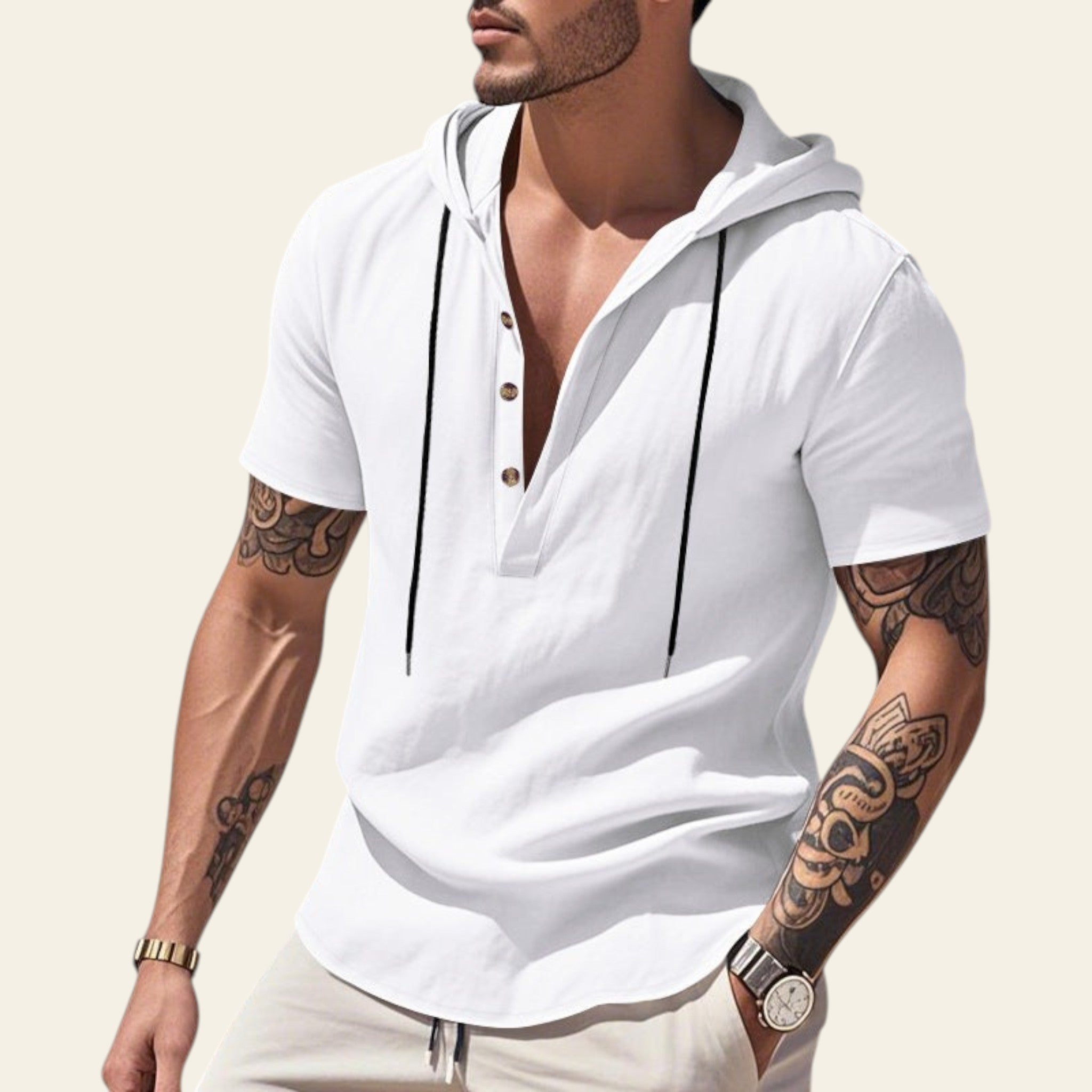 Man wearing a white breathable linen hooded short sleeve henley shirt at the beach