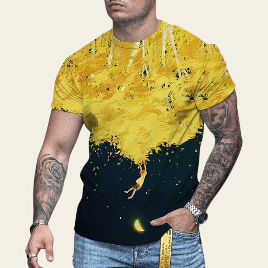 Man wearing a yellow and black graphic t-shirt on a blurred street background