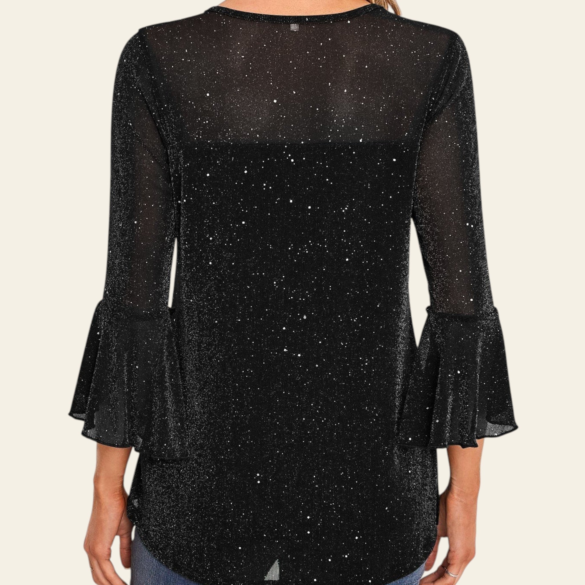 Black glittery blouse with ruffled sleeves worn by a person indoors.