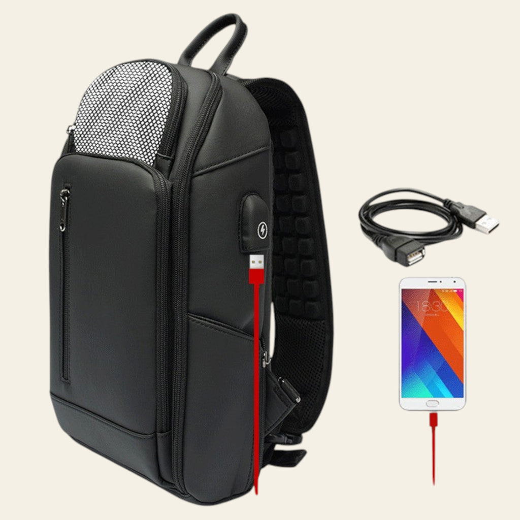 Black backpack with USB charging port, cable, and smartphone on a white background