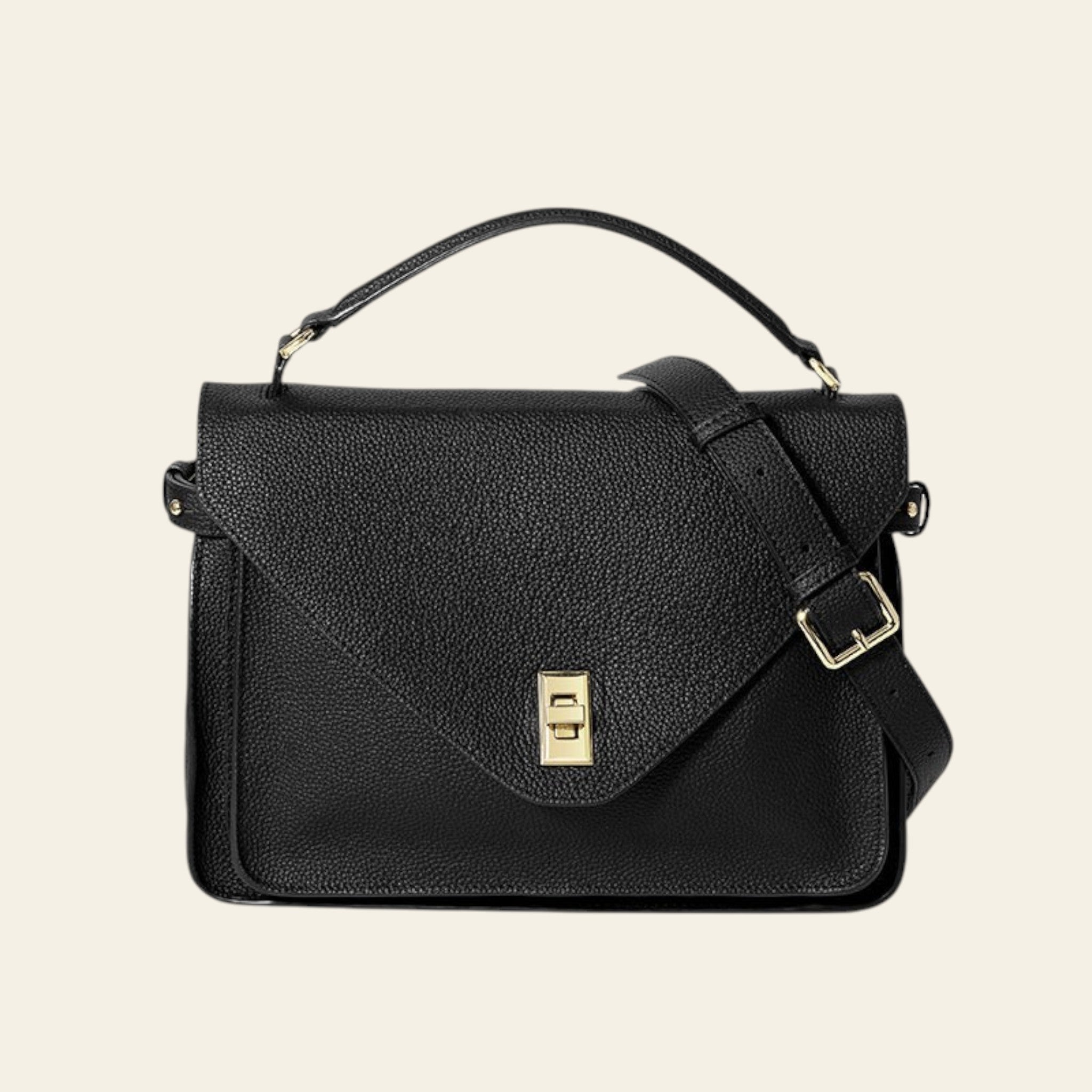 Black leather handbag with gold accents on a white background