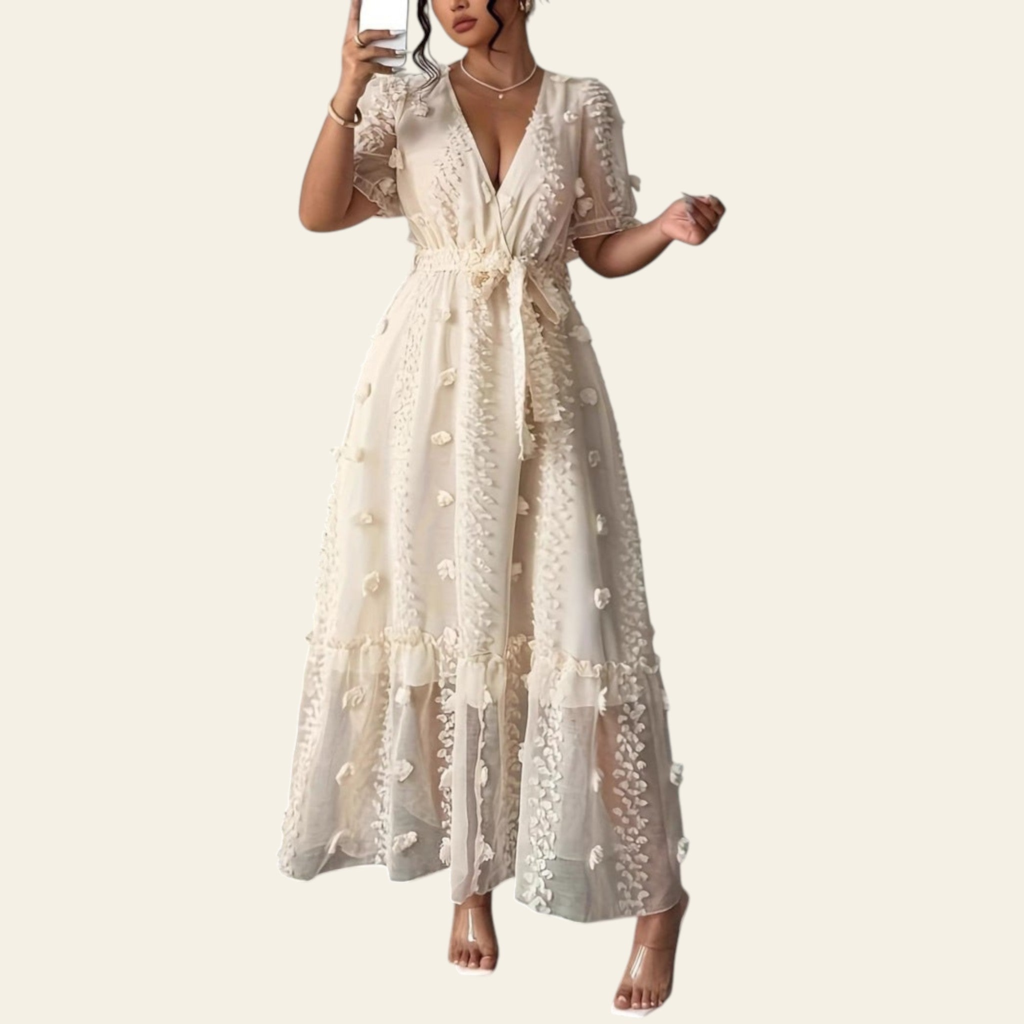 Woman wearing an embroidered halter neck backless maxi dress with a side split, front view