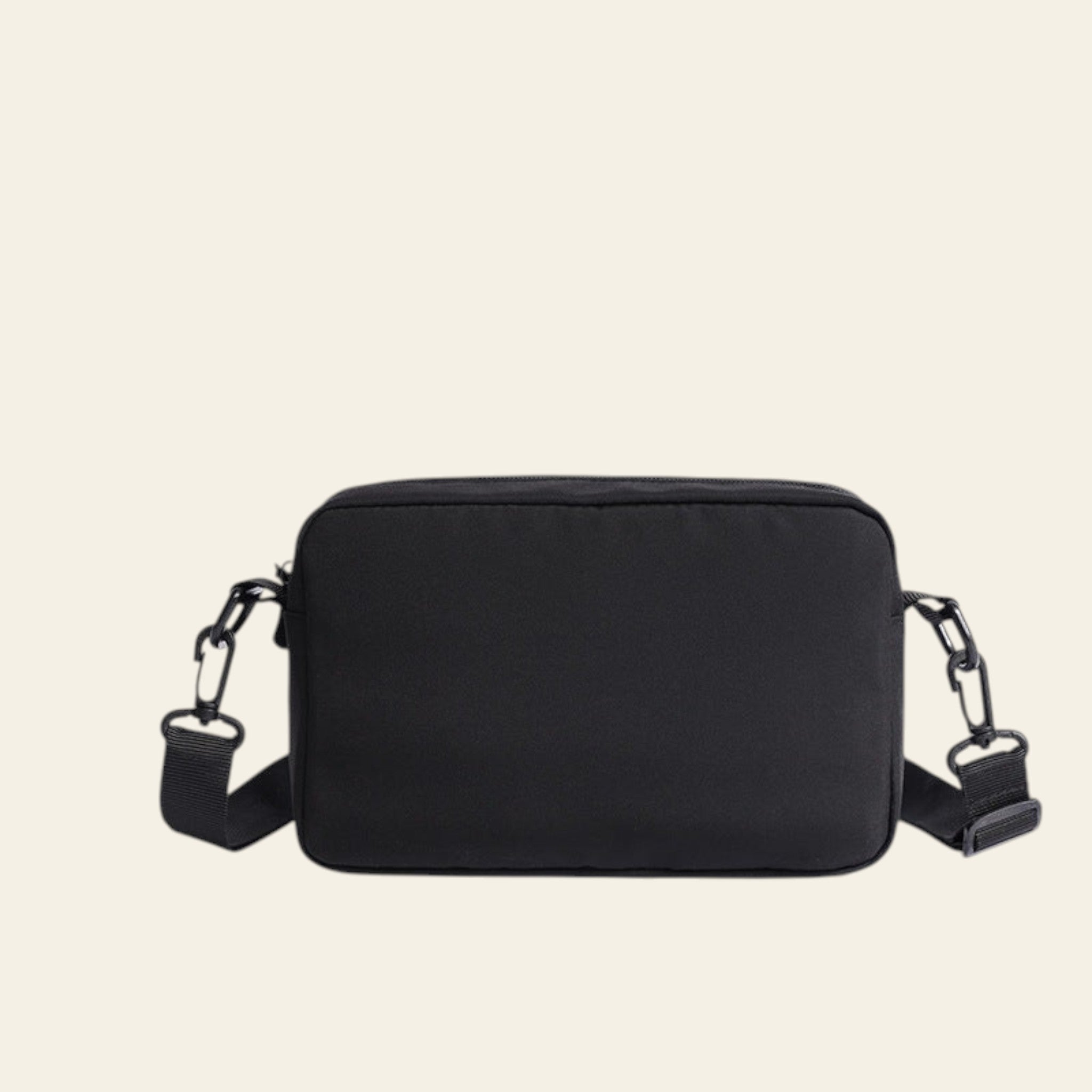 Black camera bag with chain straps on a white background