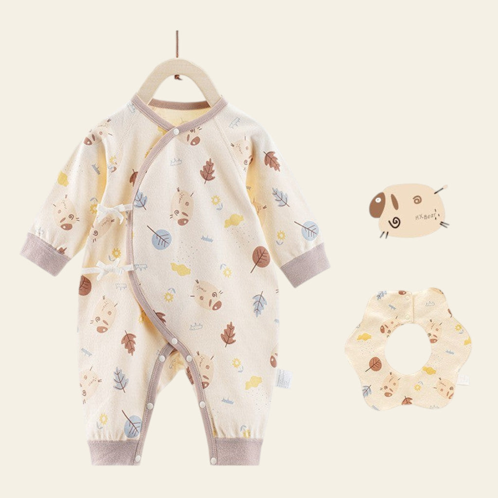 Baby romper with leaf pattern and matching headband on a white background