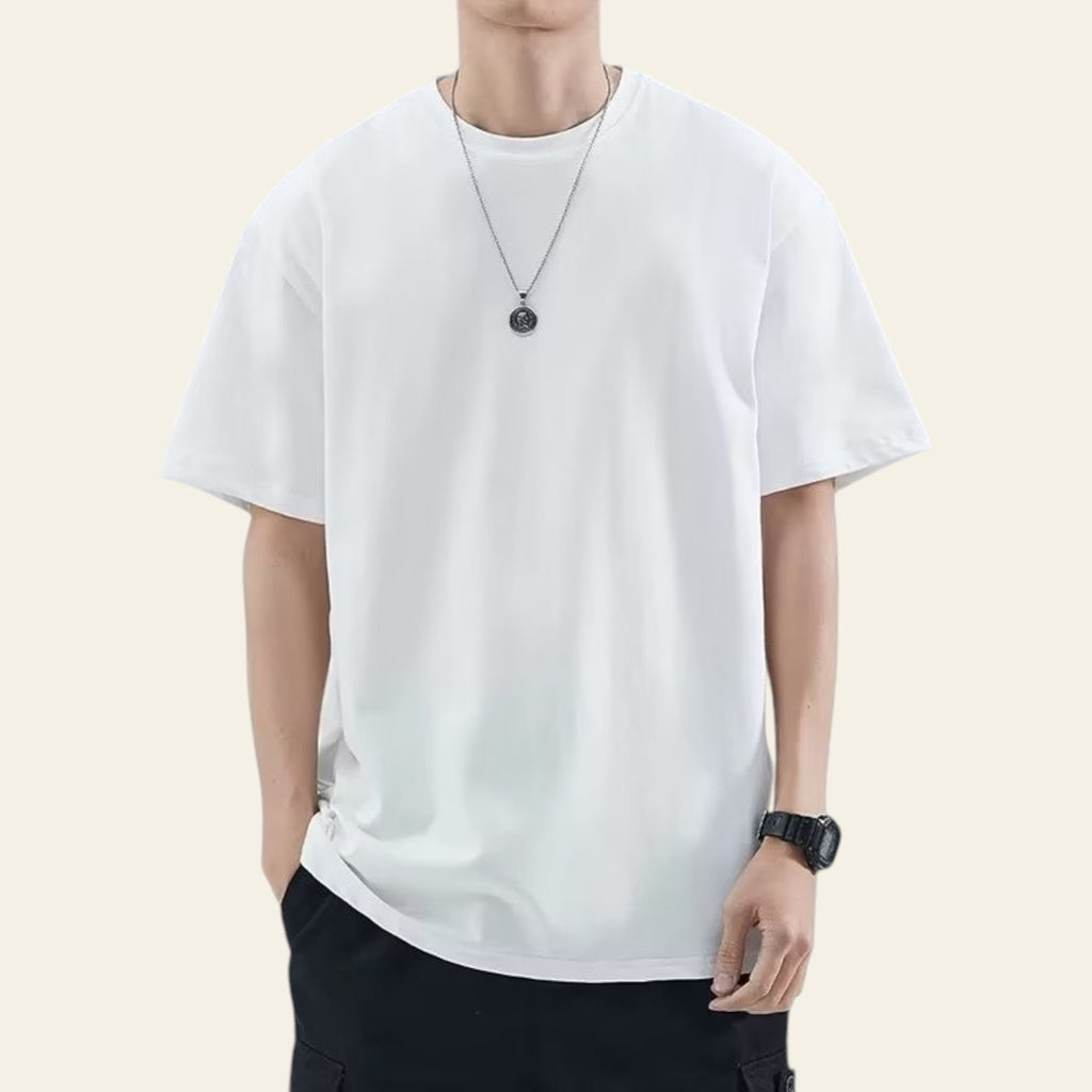 Man wearing a white loose fit solid color t-shirt