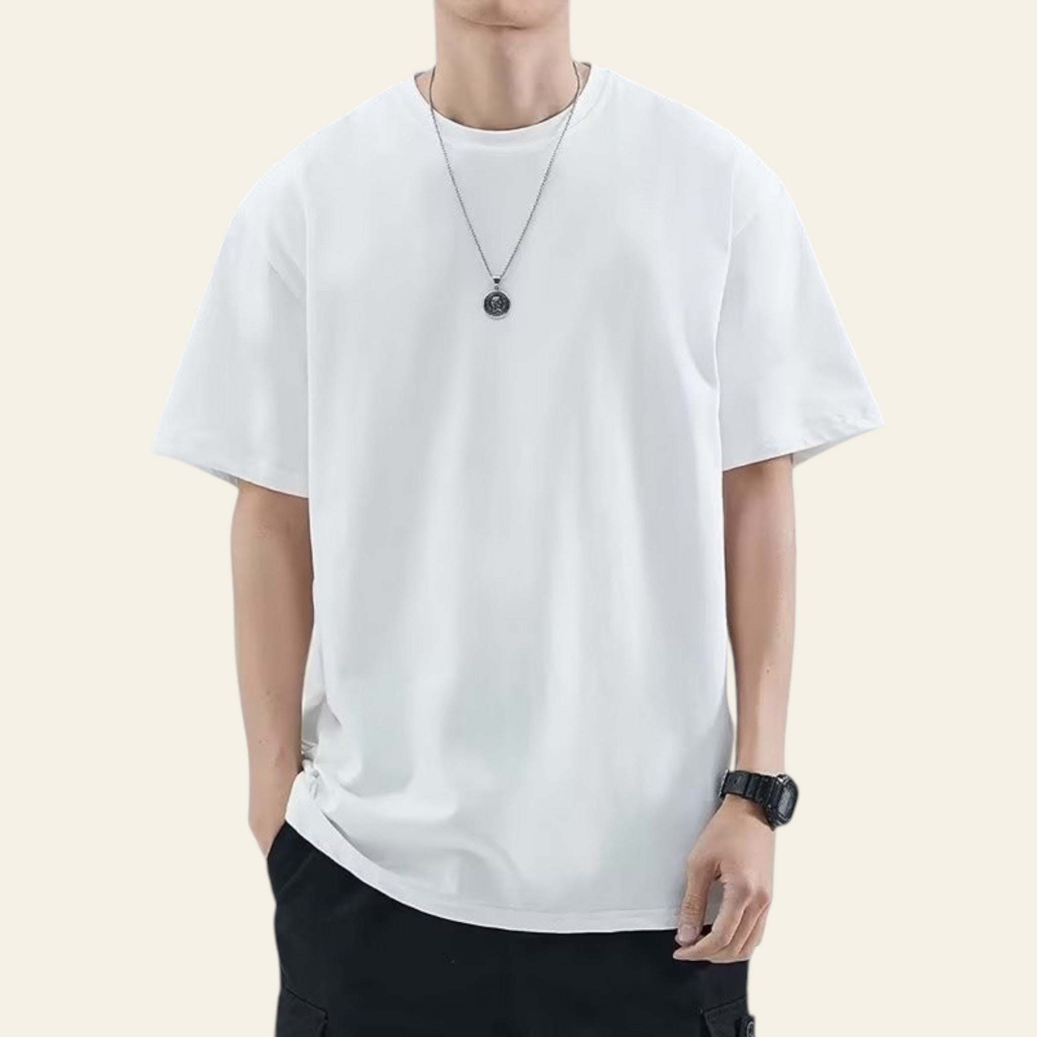 Man wearing a white loose fit solid color t-shirt