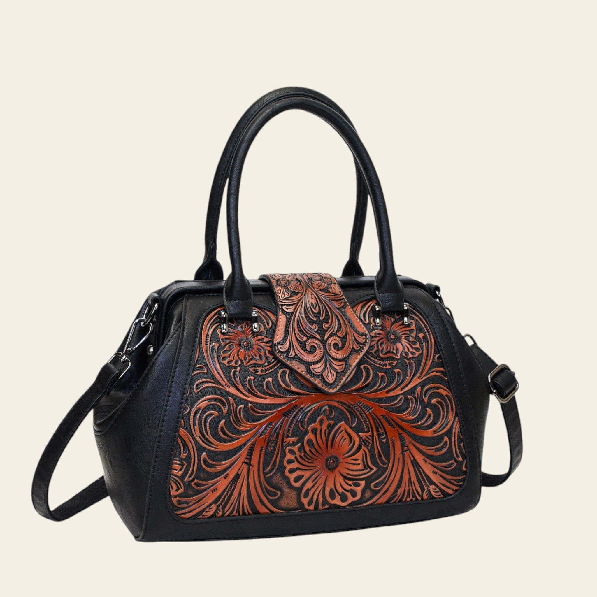 Black handbag with intricate brown leather floral patterns on a white background