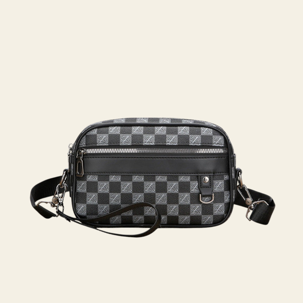 Black and gray checkered bag on a wooden surface with a white background