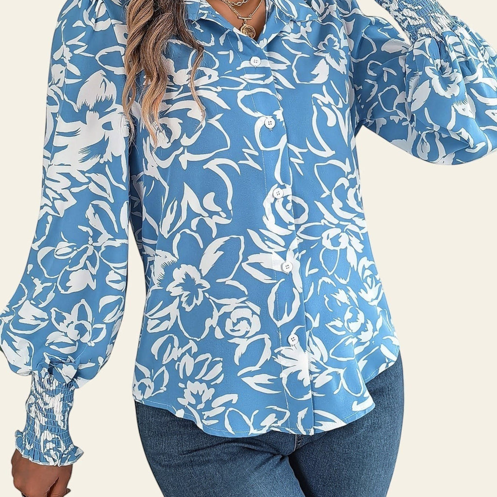 Woman wearing a blue floral blouse with a white background