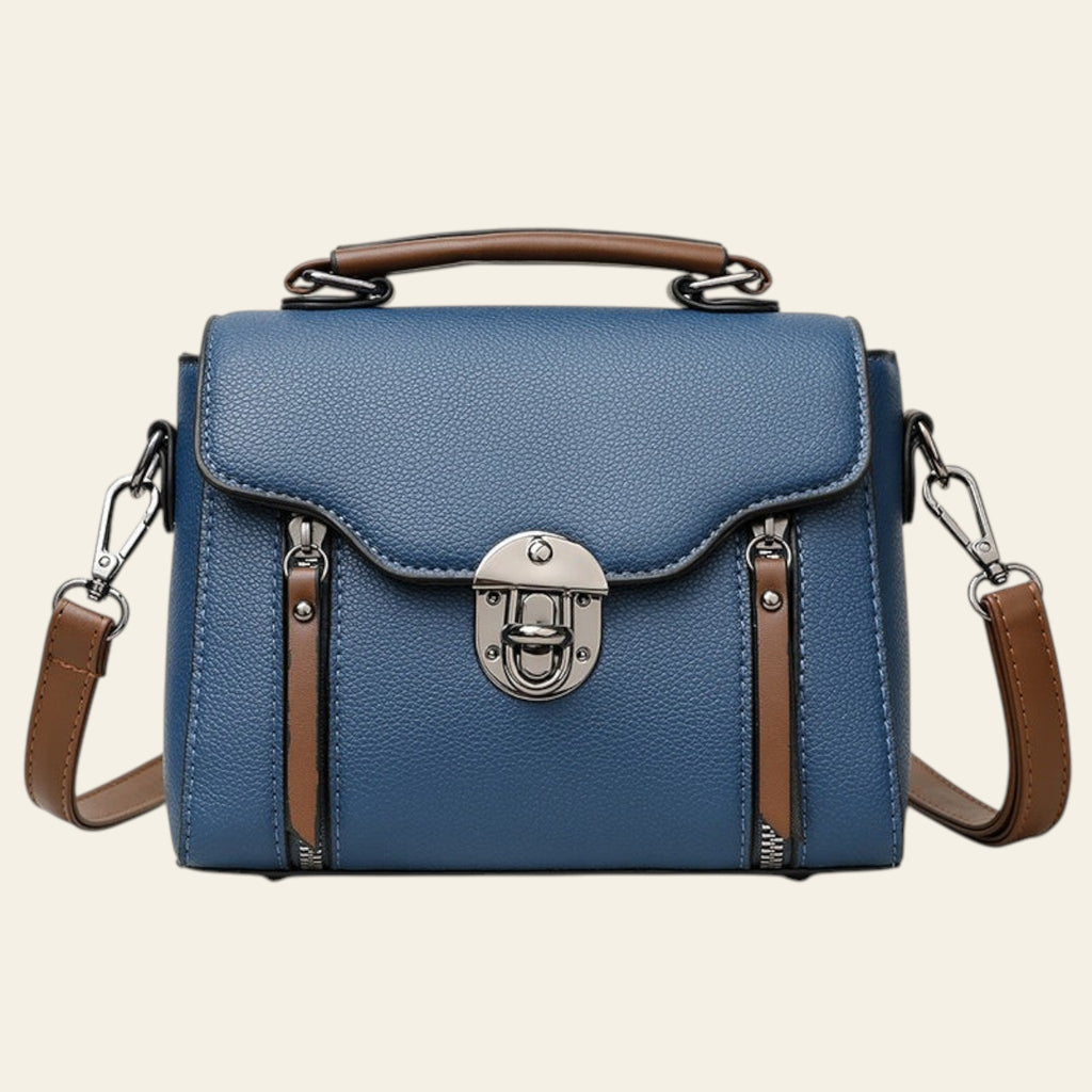 Blue handbag with brown accents on a white background