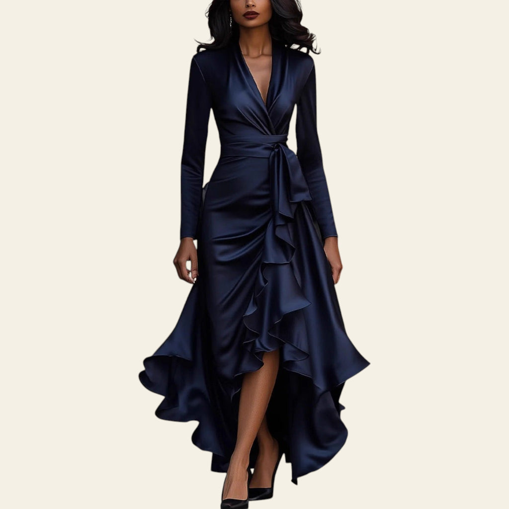 Woman wearing a navy blue satin V-neck ruffled hem dress walking on a city street