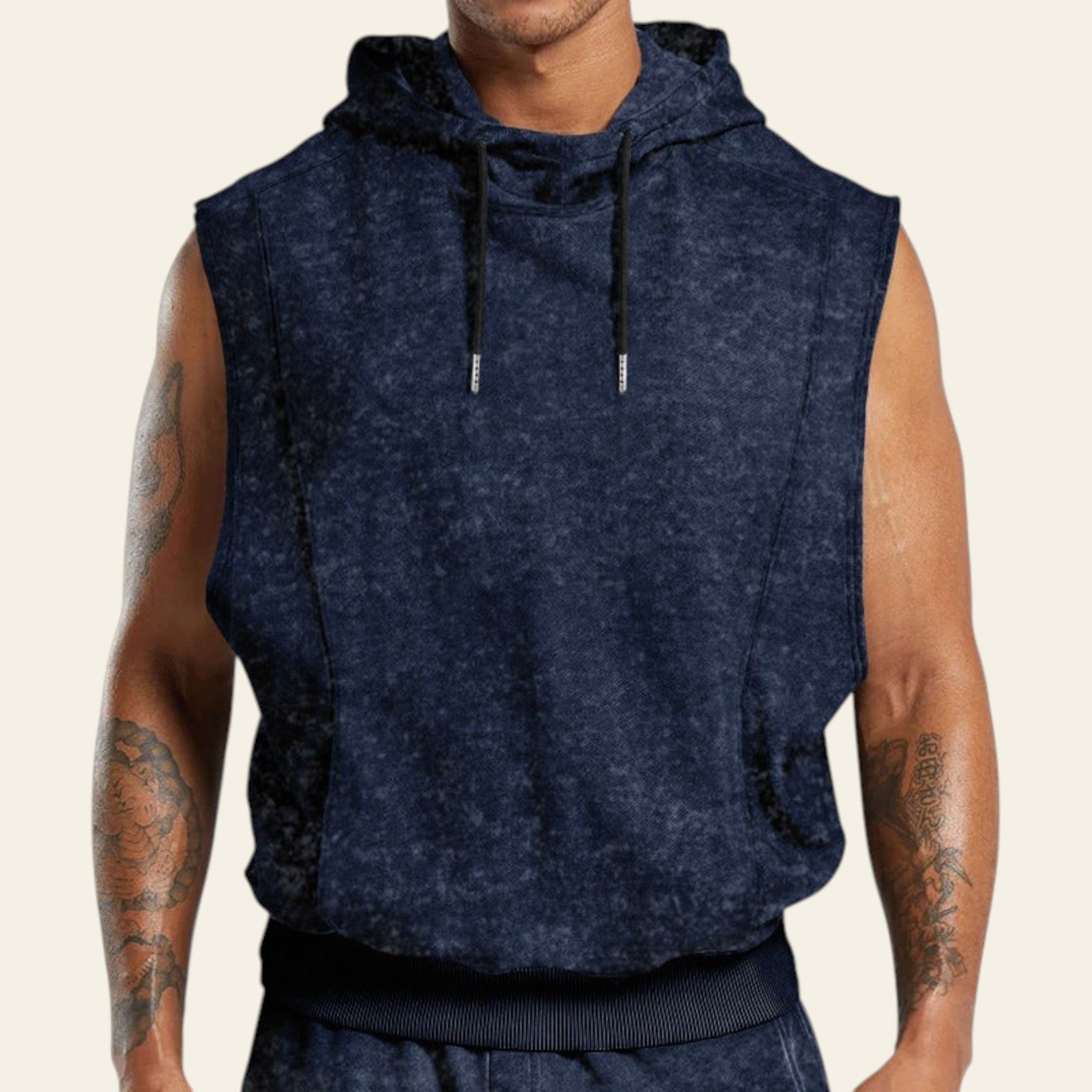 Man wearing a navy blue sleeveless hoodie on a white background