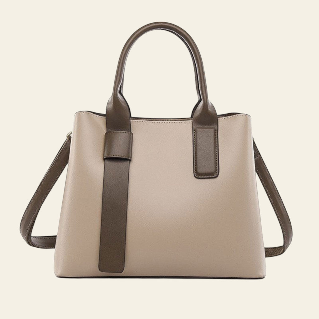 Beige handbag with brown accents on a white background