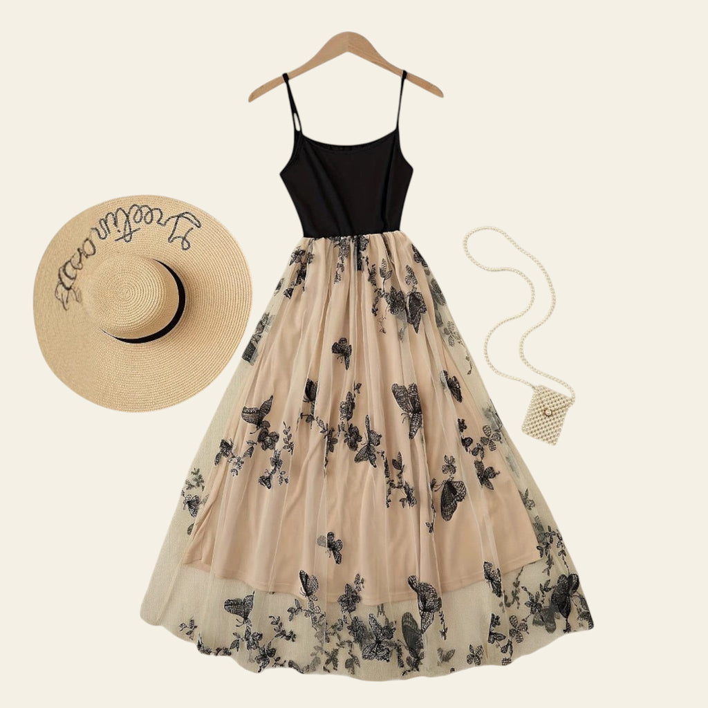 Black butterfly print colo-block slip dress flat lay on a light background
