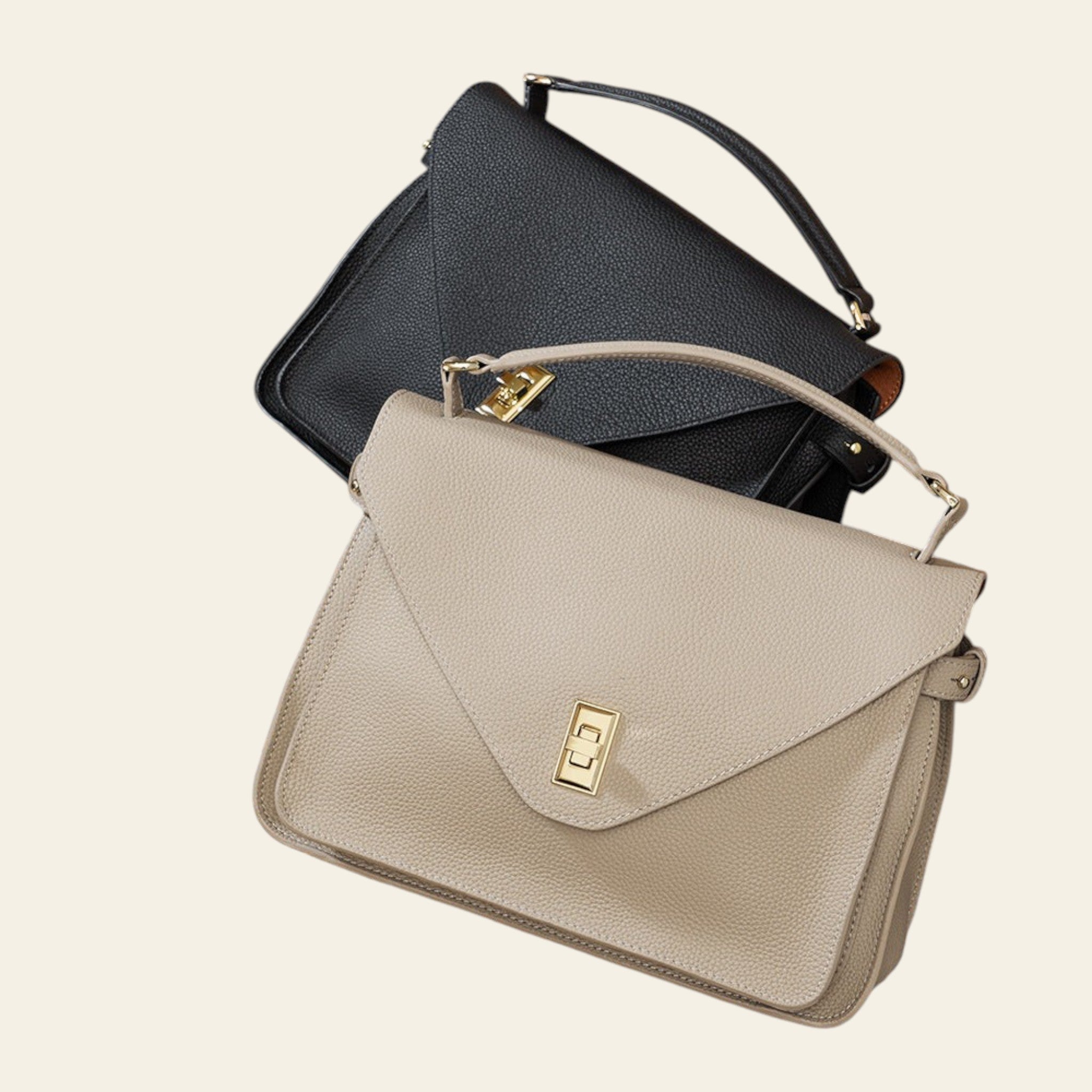 Two handbags, one black and one beige with a gold clasp, on a textured surface.