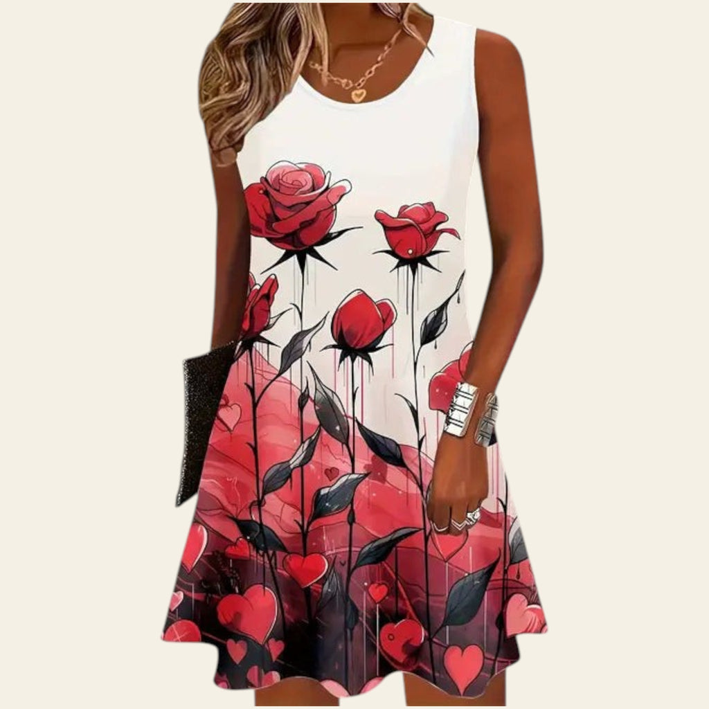 woman wearing a white sleeveless dress with red rose and pink heart patterns