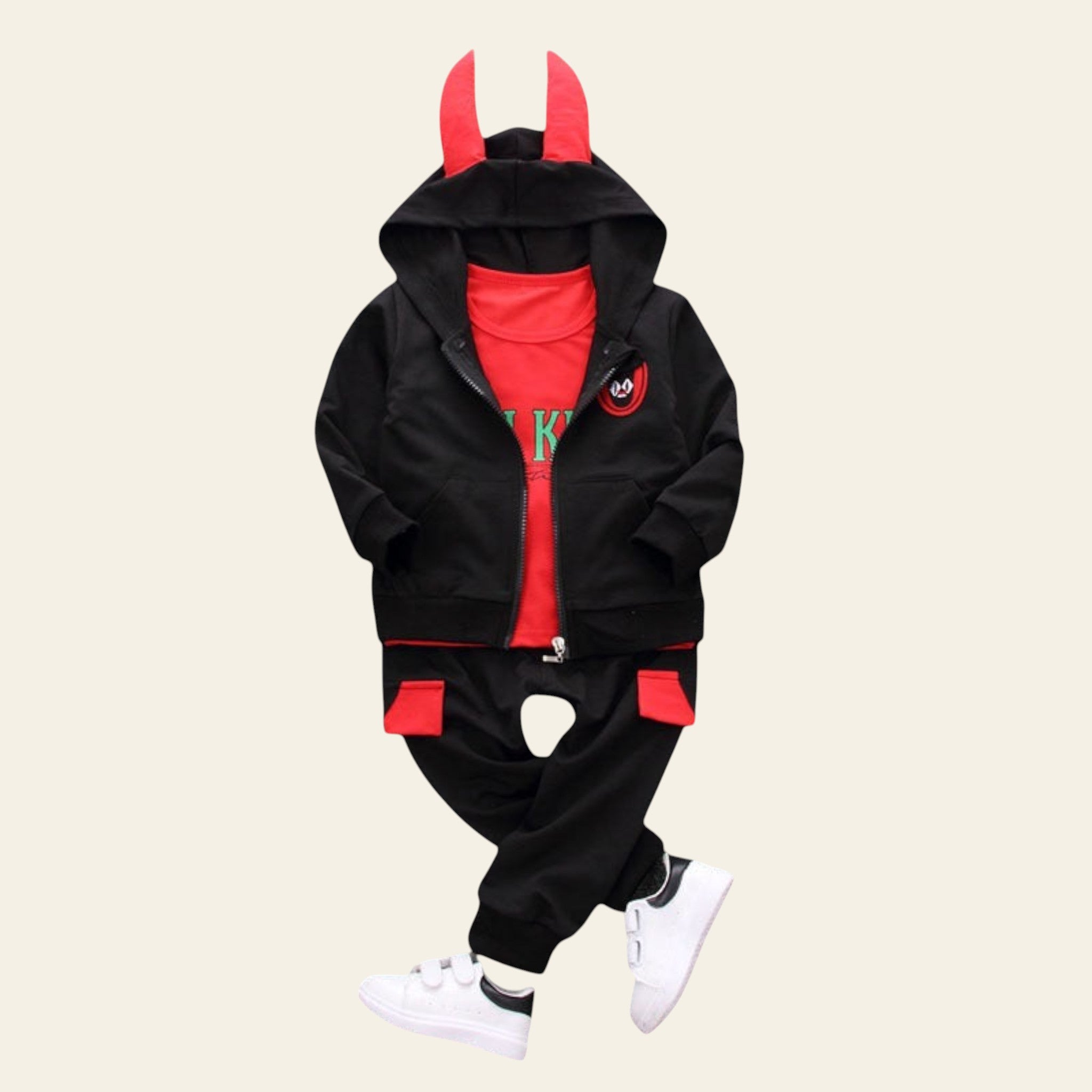 Children's black and red outfit with hood and ears on a gray background