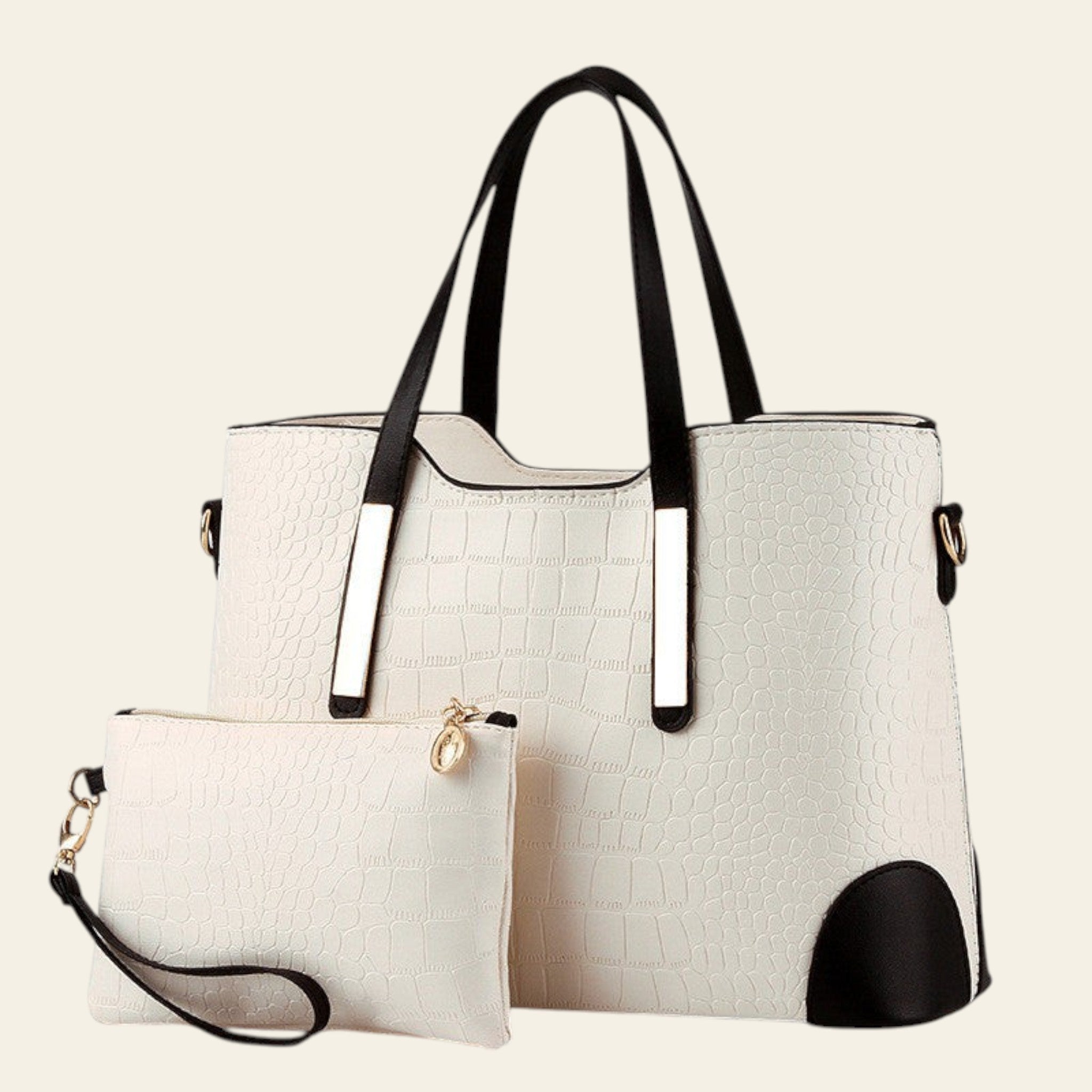 White handbag with black accents and a matching pouch on a white background