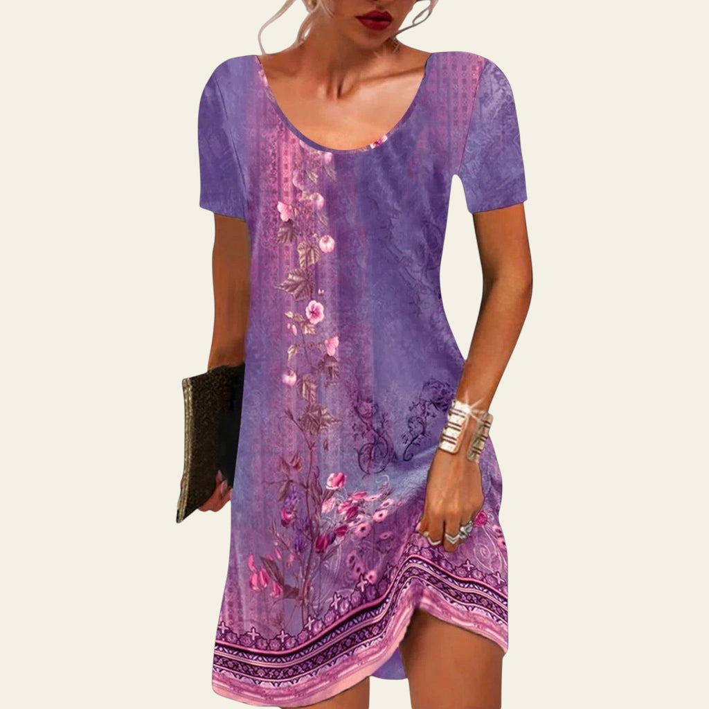 woman wearing a purple floral short-sleeve summer dress with a relaxed fit