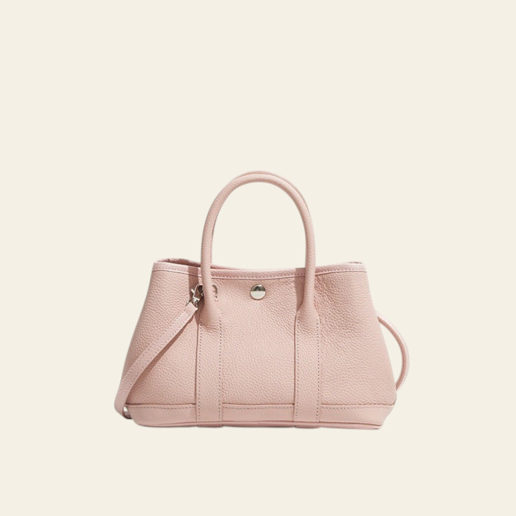 Pink handbag on a white background