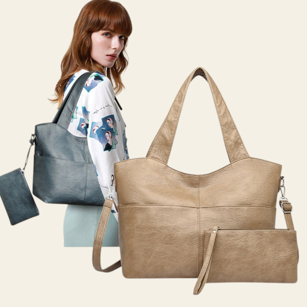 Woman holding a gray handbag with a beige tote bag in front on a white background