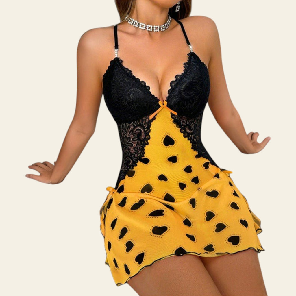 Woman wearing a sunflower yellow heart-print camisole nightgown dress (front view)