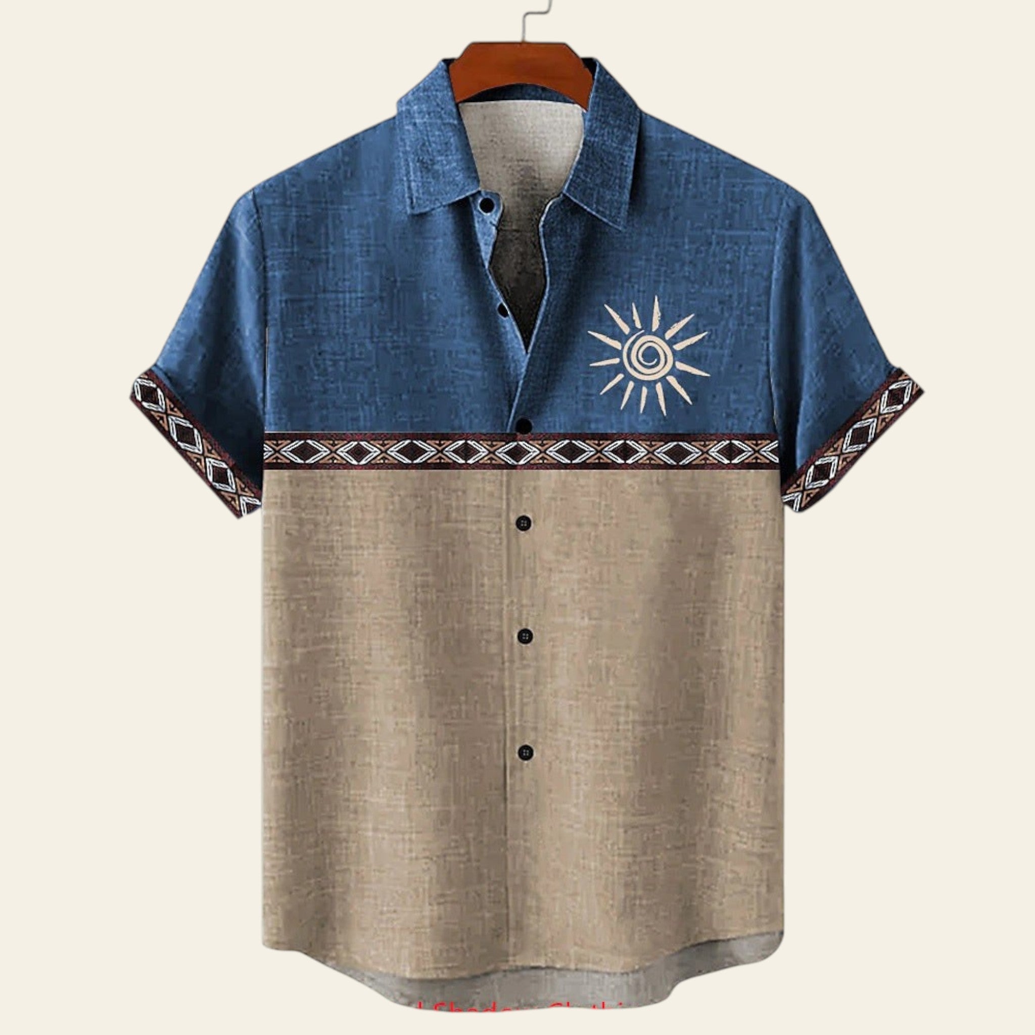 Two-tone shirt with sun design on a hanger against a white background