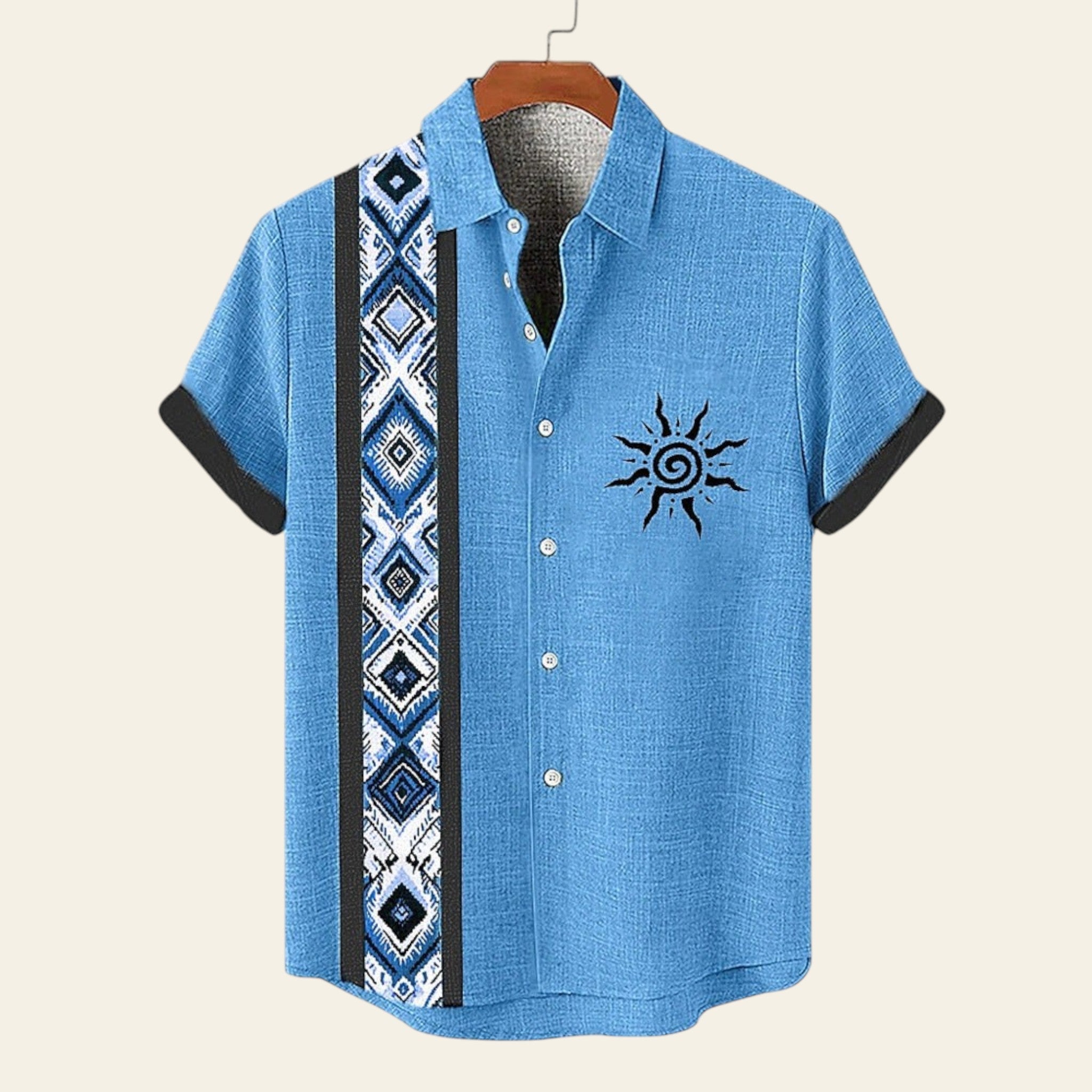 Blue short-sleeve shirt with a sun design and patterned strap on a white background