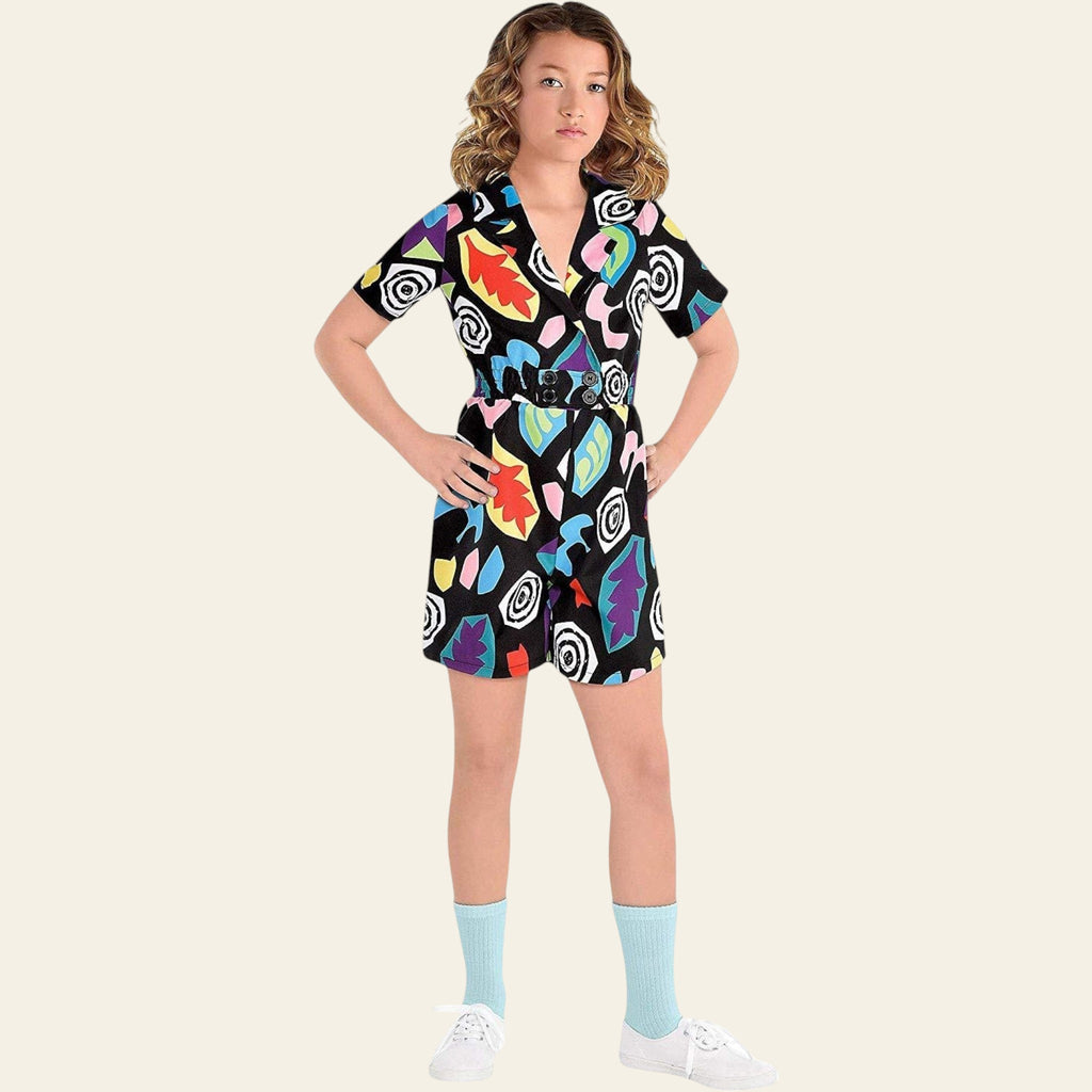 Young girl wearing a colorful dress with abstract patterns on a white background