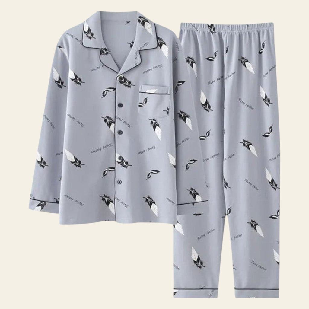 Gray pajama set with bird pattern on a green background