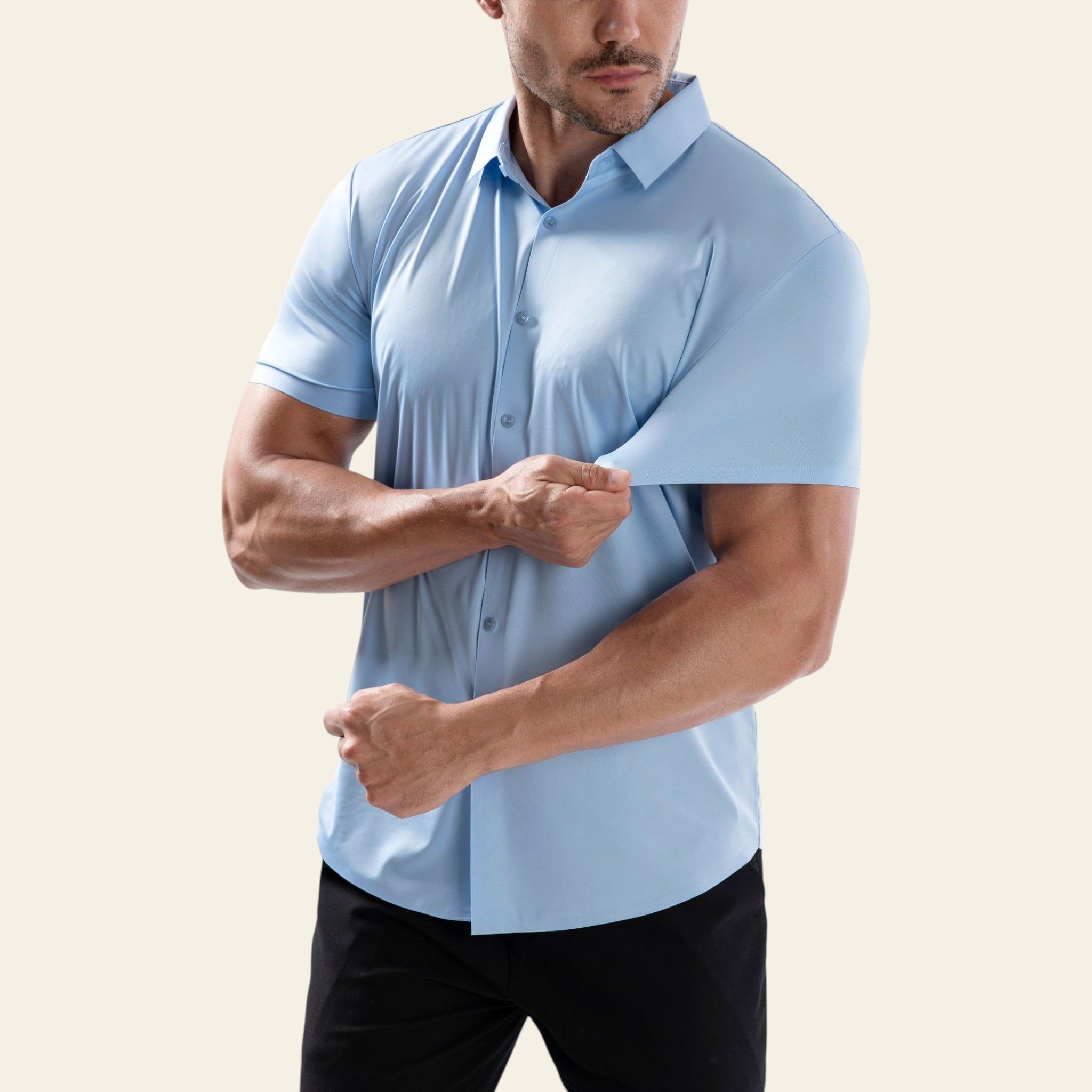 Man wearing a light blue short-sleeve shirt on a white background