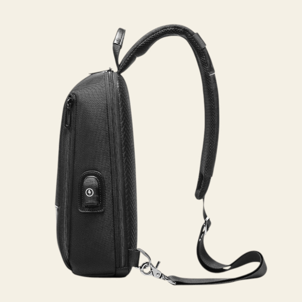 Black backpack with USB port on a white background