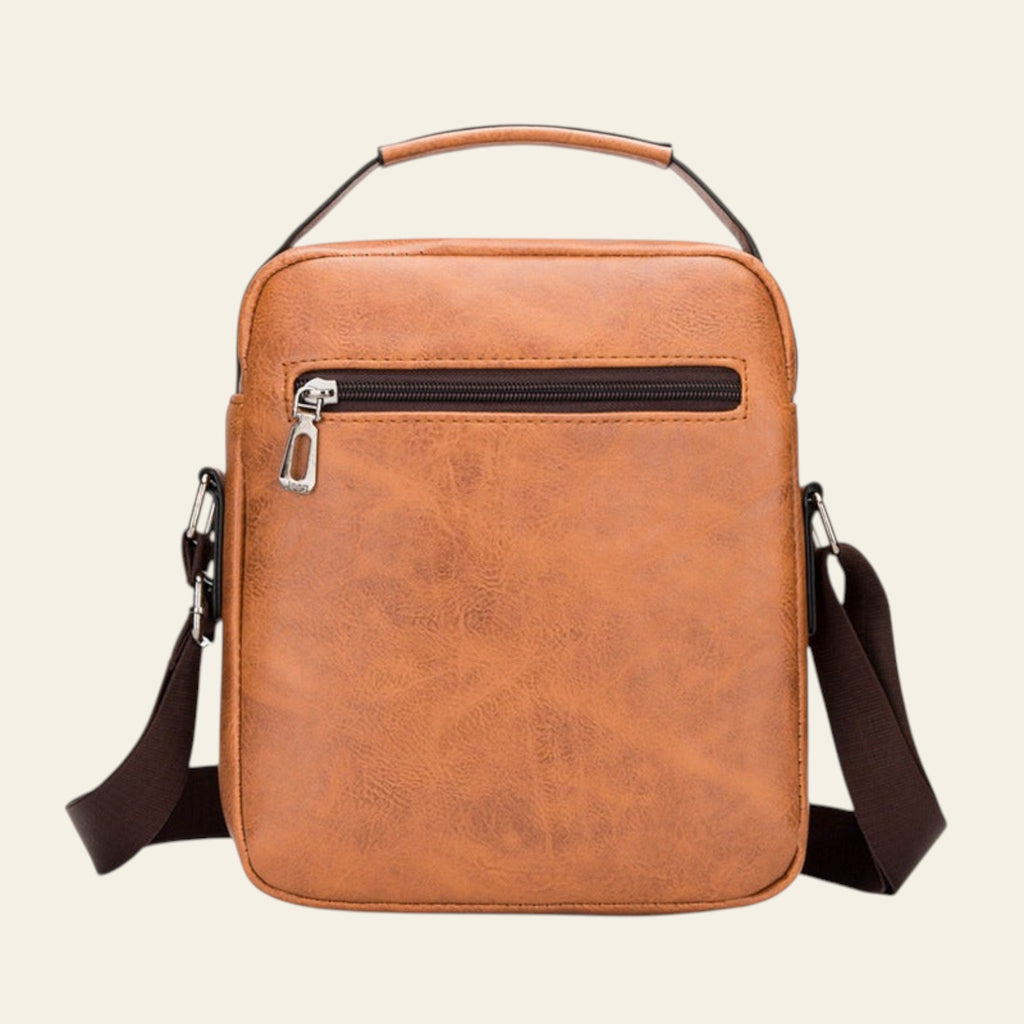 Brown leather crossbody bag on a white background