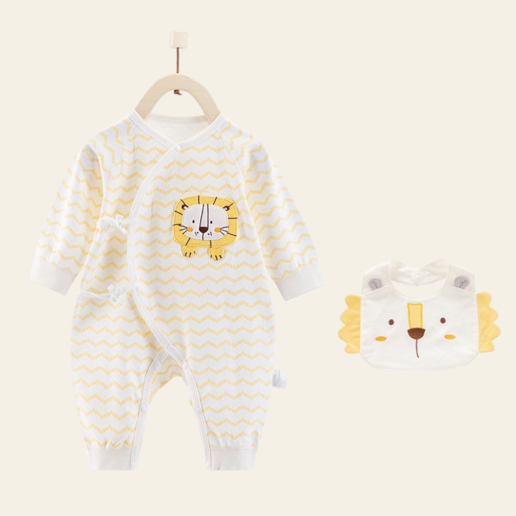 Baby onesie with lion design and matching bib on a white background