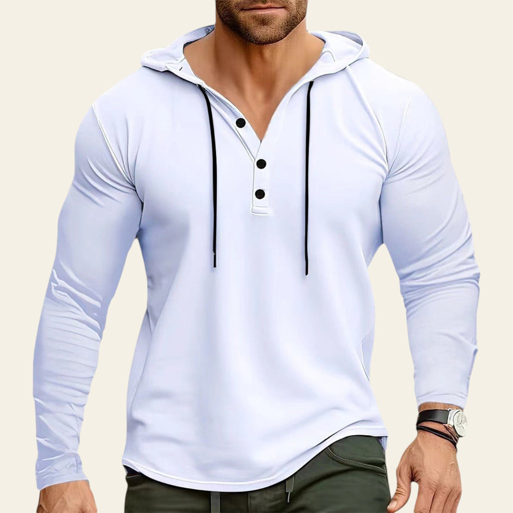 Man wearing a light blue long-sleeve shirt with a hood on a white background