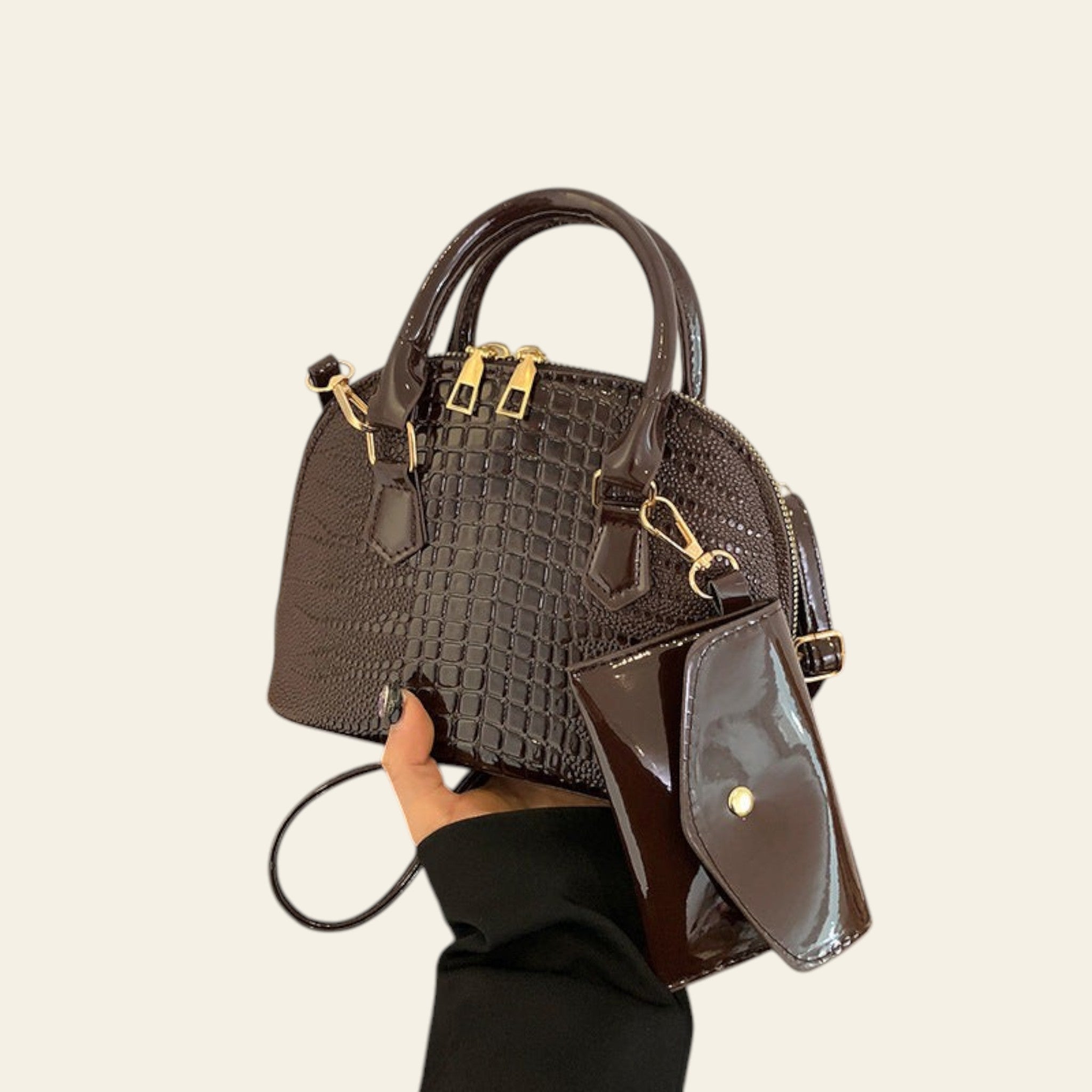 Brown textured satchel handbag with gold hardware and top handle