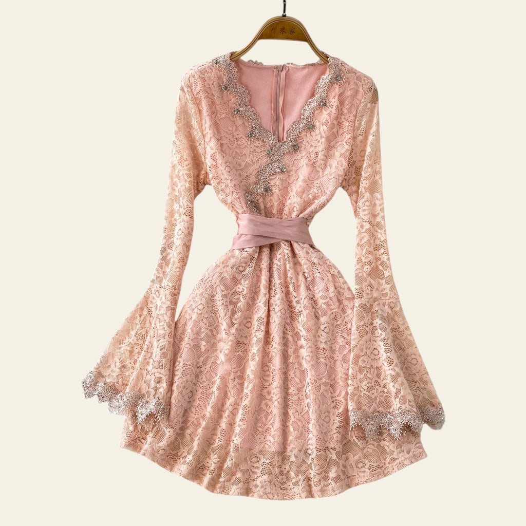 Pink lace V-neck midi dress displayed flat on a soft background