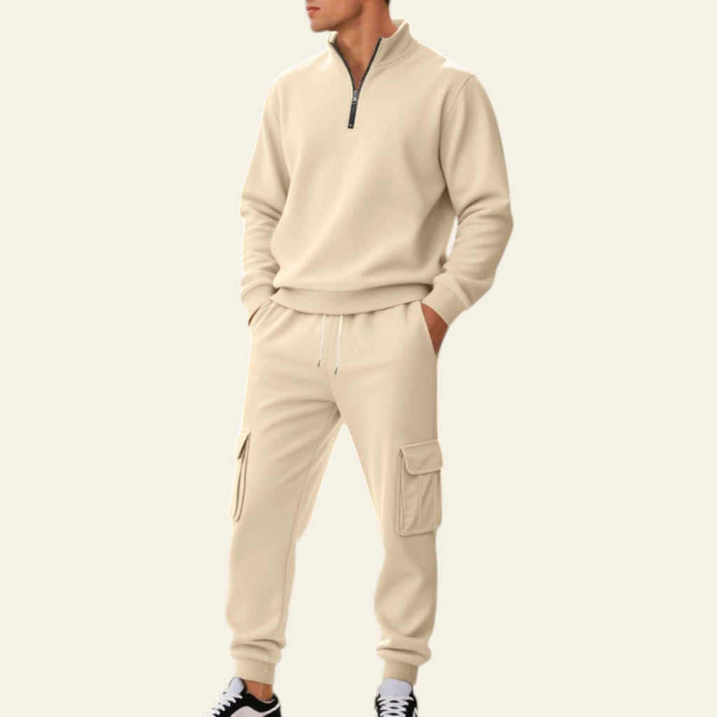 Man wearing an apricot fleece-lined tracksuit set with zip-up jacket and jogger pants on a city street