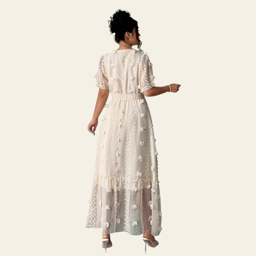 Back view showing the backless halter neck design and maxi length