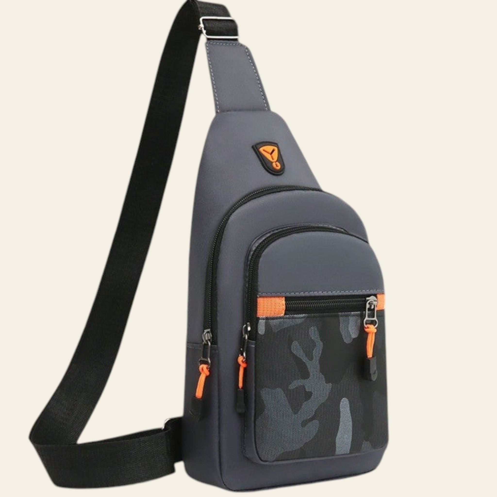 Gray sling bag with black strap on a wooden surface with a cityscape background