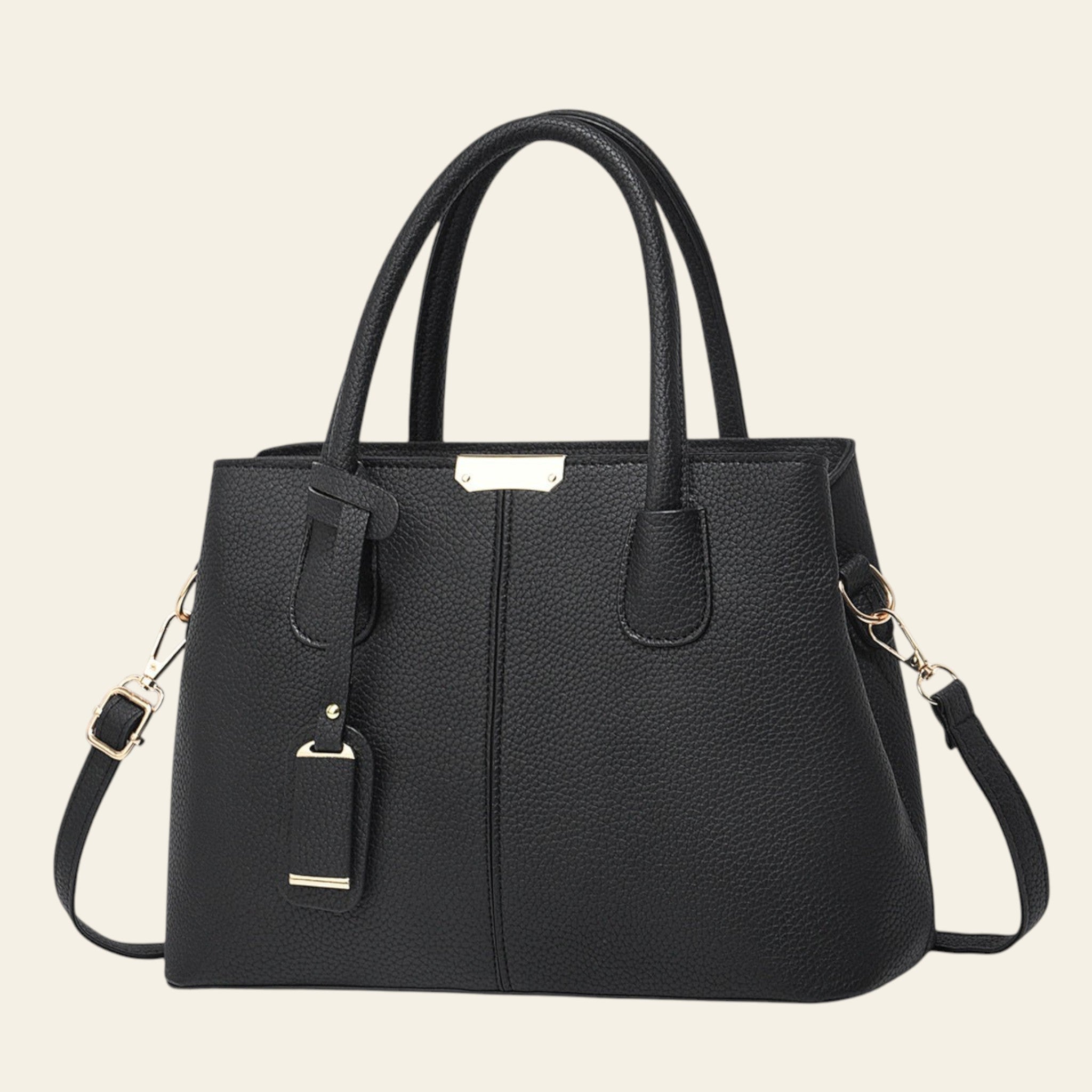 Black handbag with gold accents on a white background