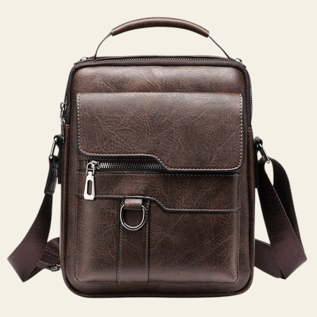 Brown leather crossbody bag on a white background