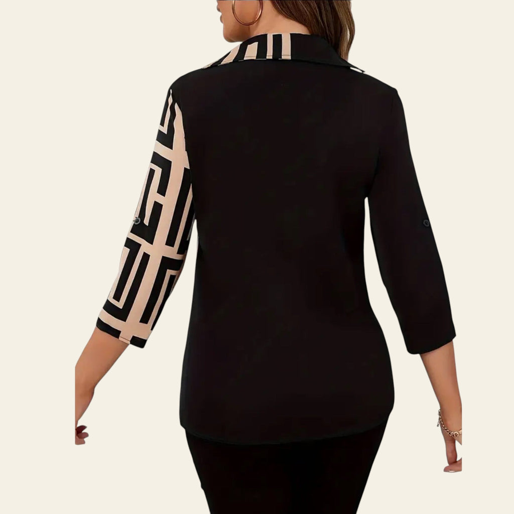 Black blazer with geometric patterned sleeves on a plain background