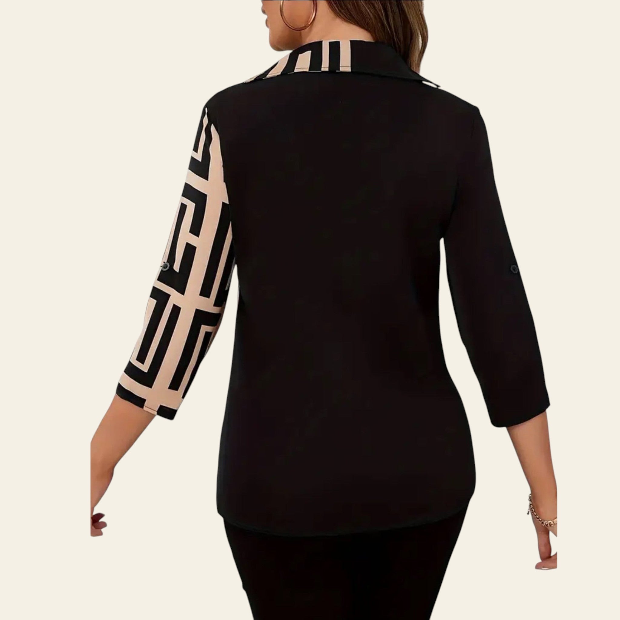 Black blazer with geometric patterned sleeves on a plain background