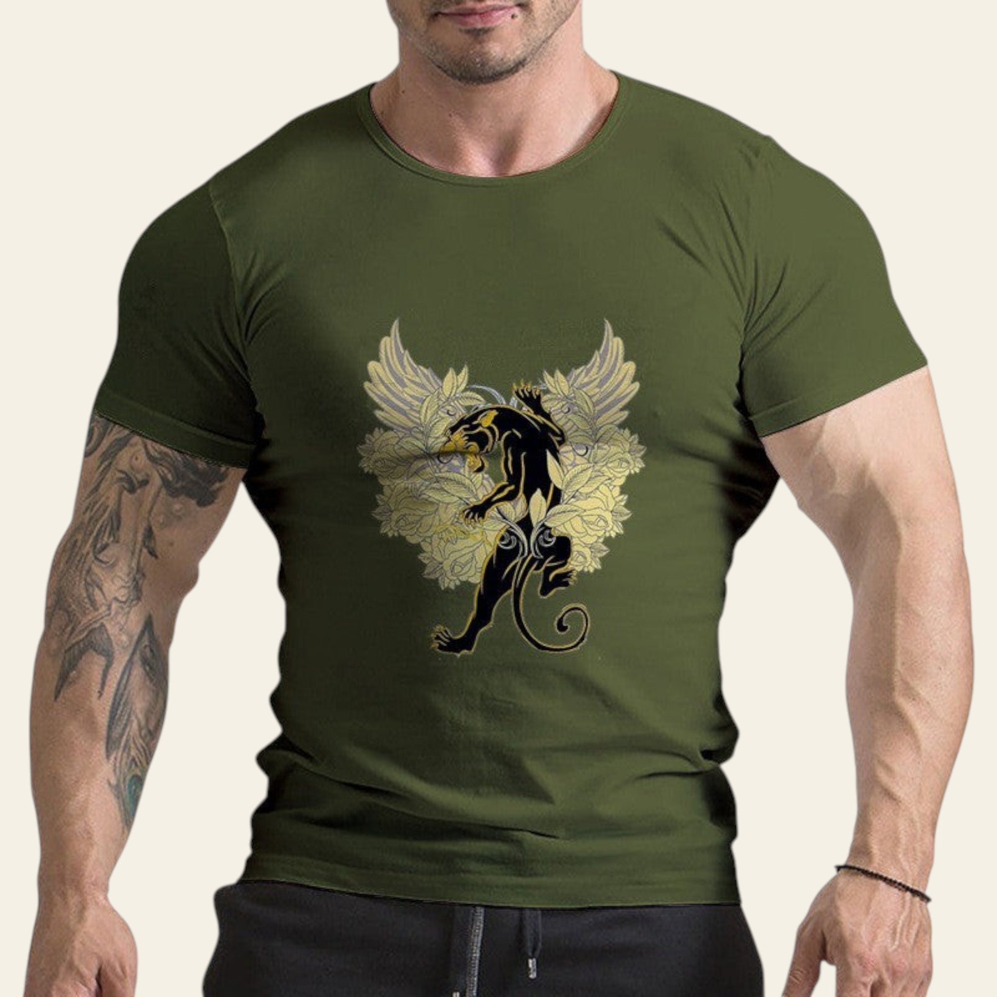 Person wearing a green t-shirt with a black and yellow graphic design on a white background