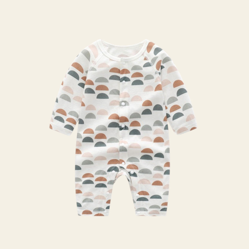 Baby romper with colorful wave pattern on a white background