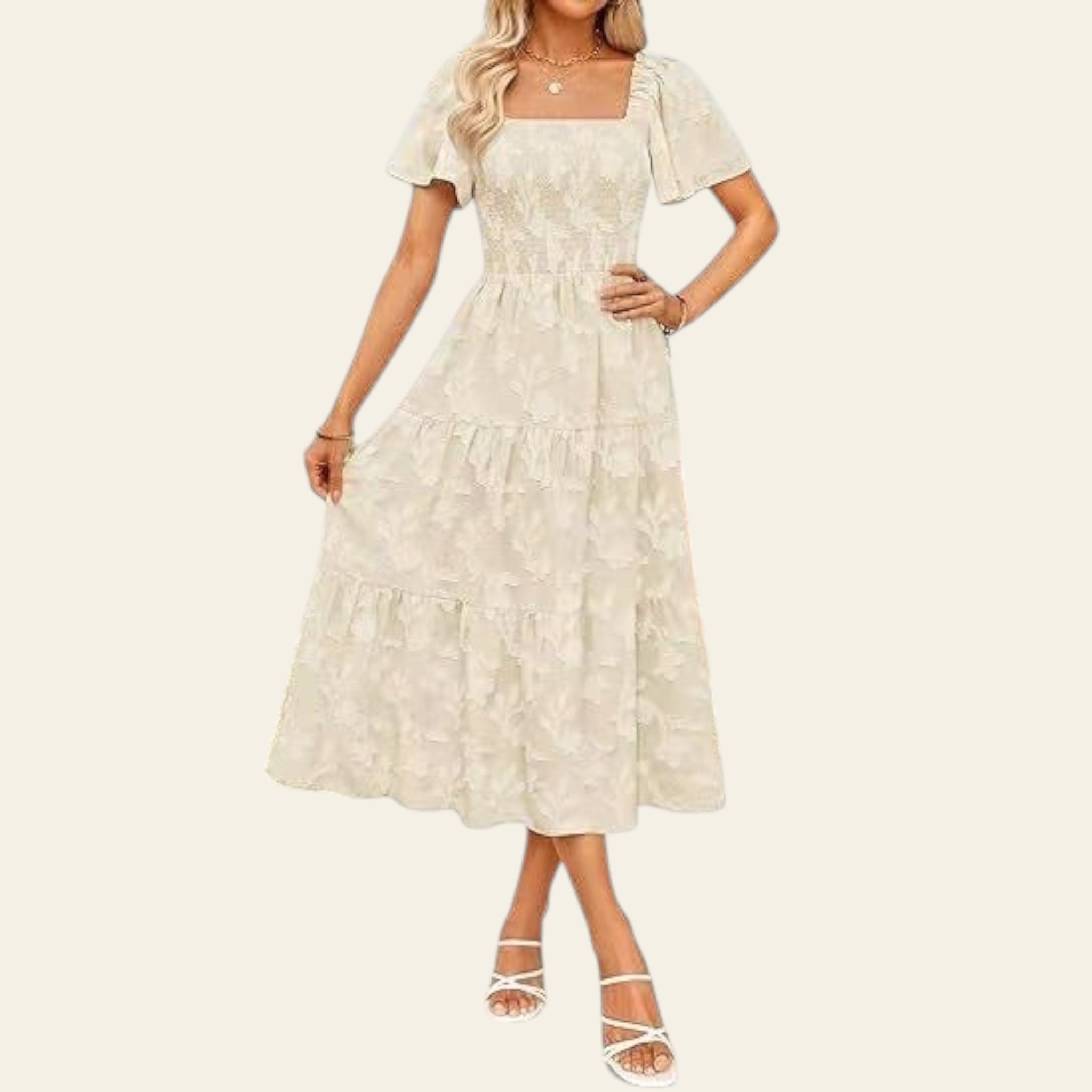 Woman wearing a white lace dress standing outdoors with a blurred background